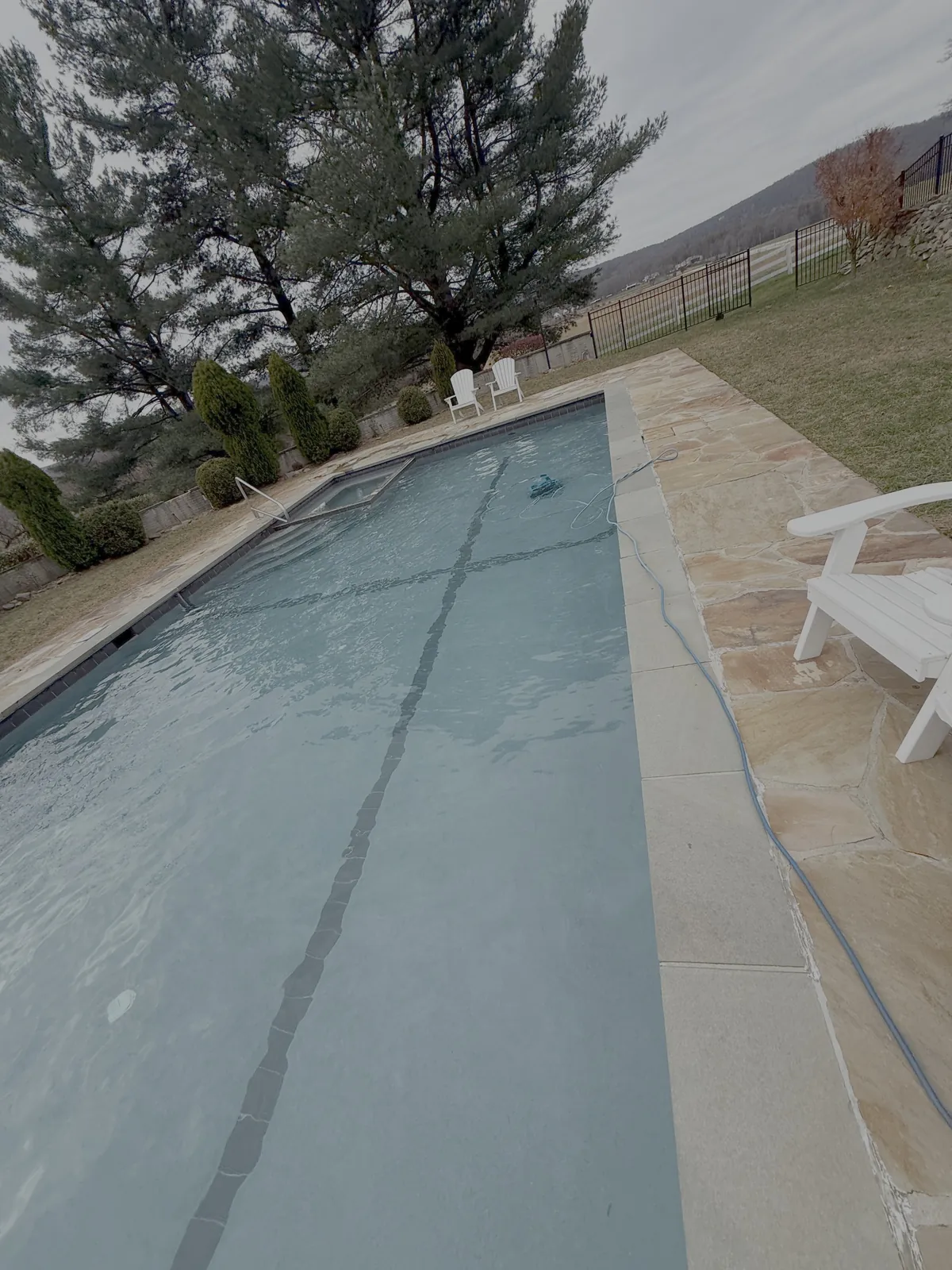 Lap pool with mountain views maintained on weekly service in Loudoun County
